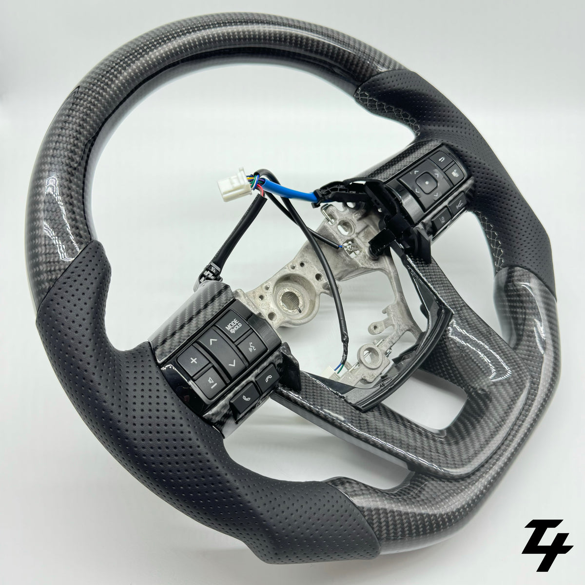 Premium Steering Wheel - Carbon Fiber / Perforated Leather suitable for use with Toyota Hilux N80 2015 - 2025