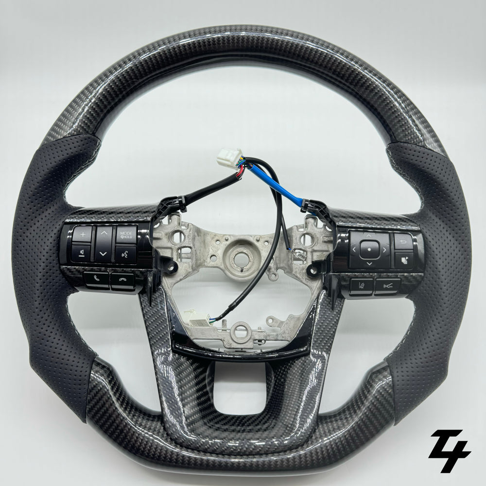TOYOTA HILUX N80 2015-2024 PREMIUM STEERING WHEEL - Carbon Fiber - Per