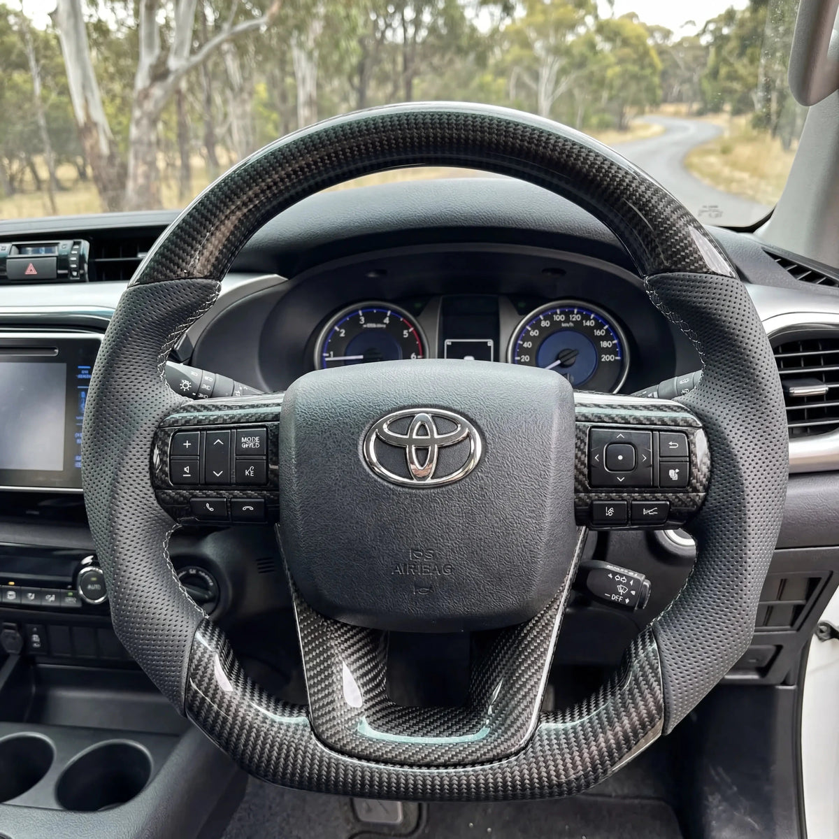 Premium Steering Wheel - Suitable for use with Toyota Hilux N80 2015 - 2026 Genuine Perforated Leather & Carbon Fiber - Tech4tourers