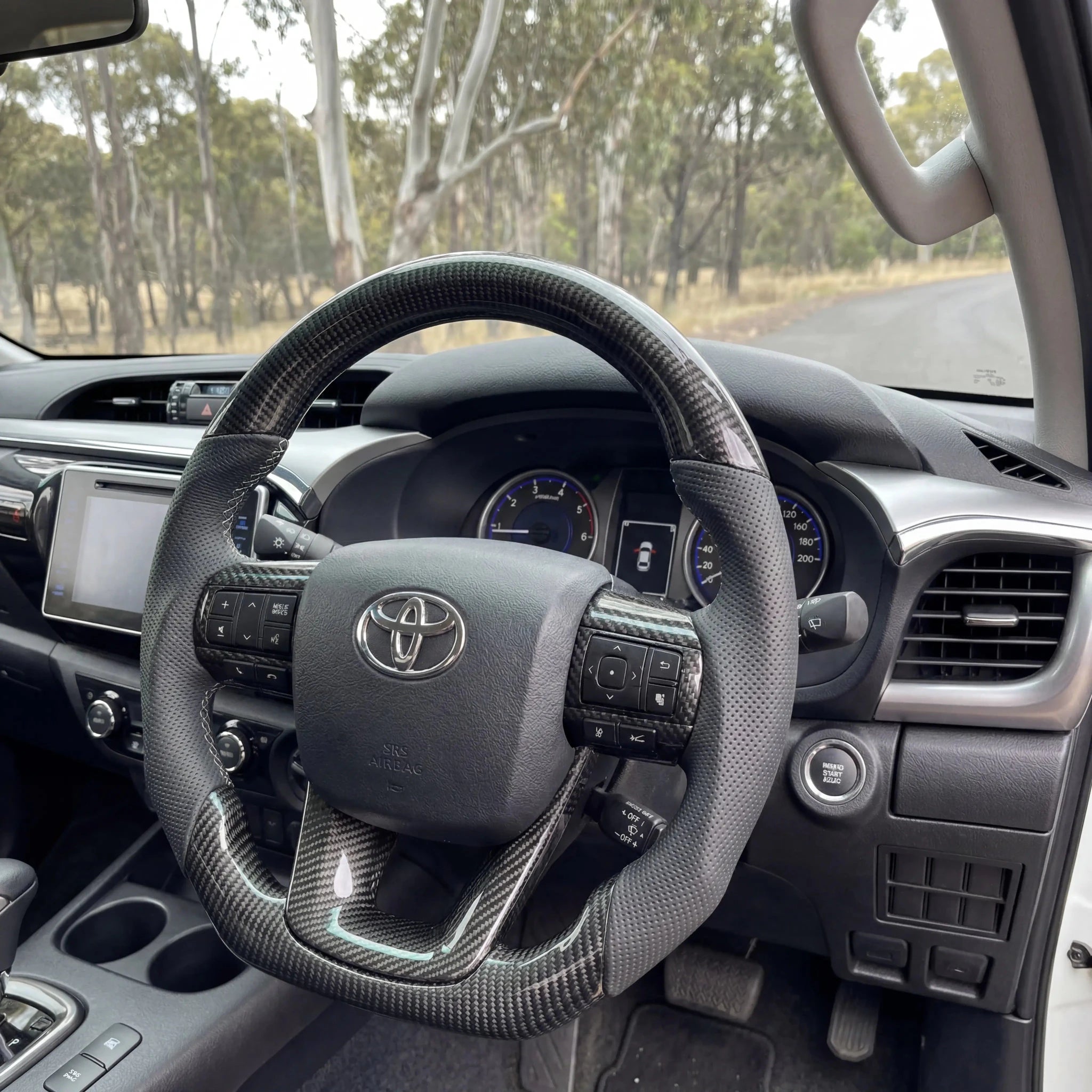 Premium Steering Wheel - Suitable for use with Toyota Hilux N80 2015 - 2026 Genuine Perforated Leather & Carbon Fiber - Tech4tourers
