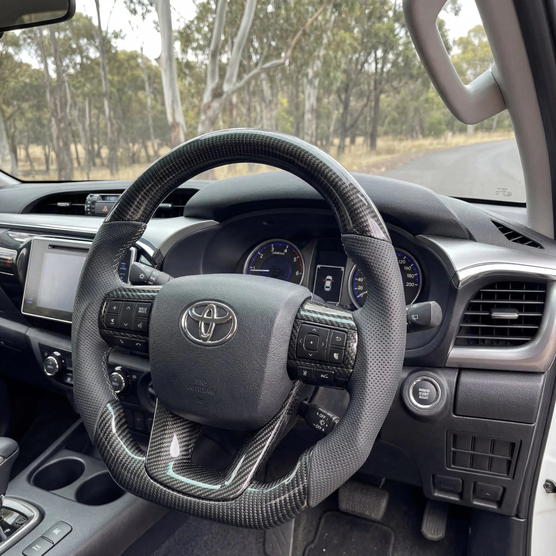 Premium Steering Wheel - Suitable for use with Toyota Hilux N80 2015 - 2026 Genuine Perforated Leather & Carbon Fiber - Tech4tourers