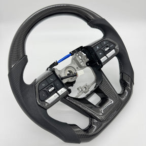 Premium Steering Wheel - Suitable for use with Toyota LandCruiser 300 series 2022 - 2026 Genuine Perforated Leather & Carbon Fiber