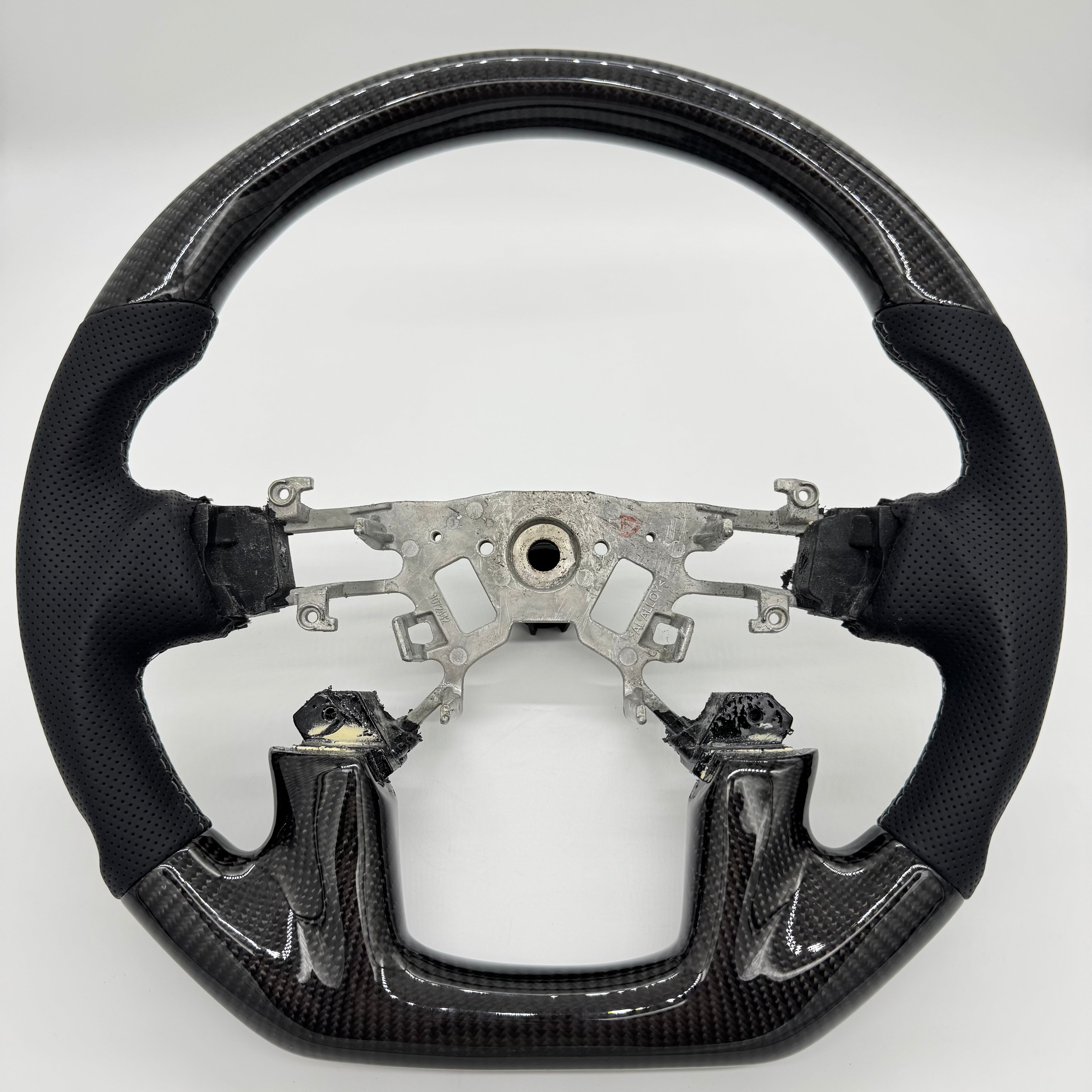 Nissan Patrol Y62 (2012–2018) Premium Steering Wheel – Carbon Fibre & Perforated Leather *Clearance*