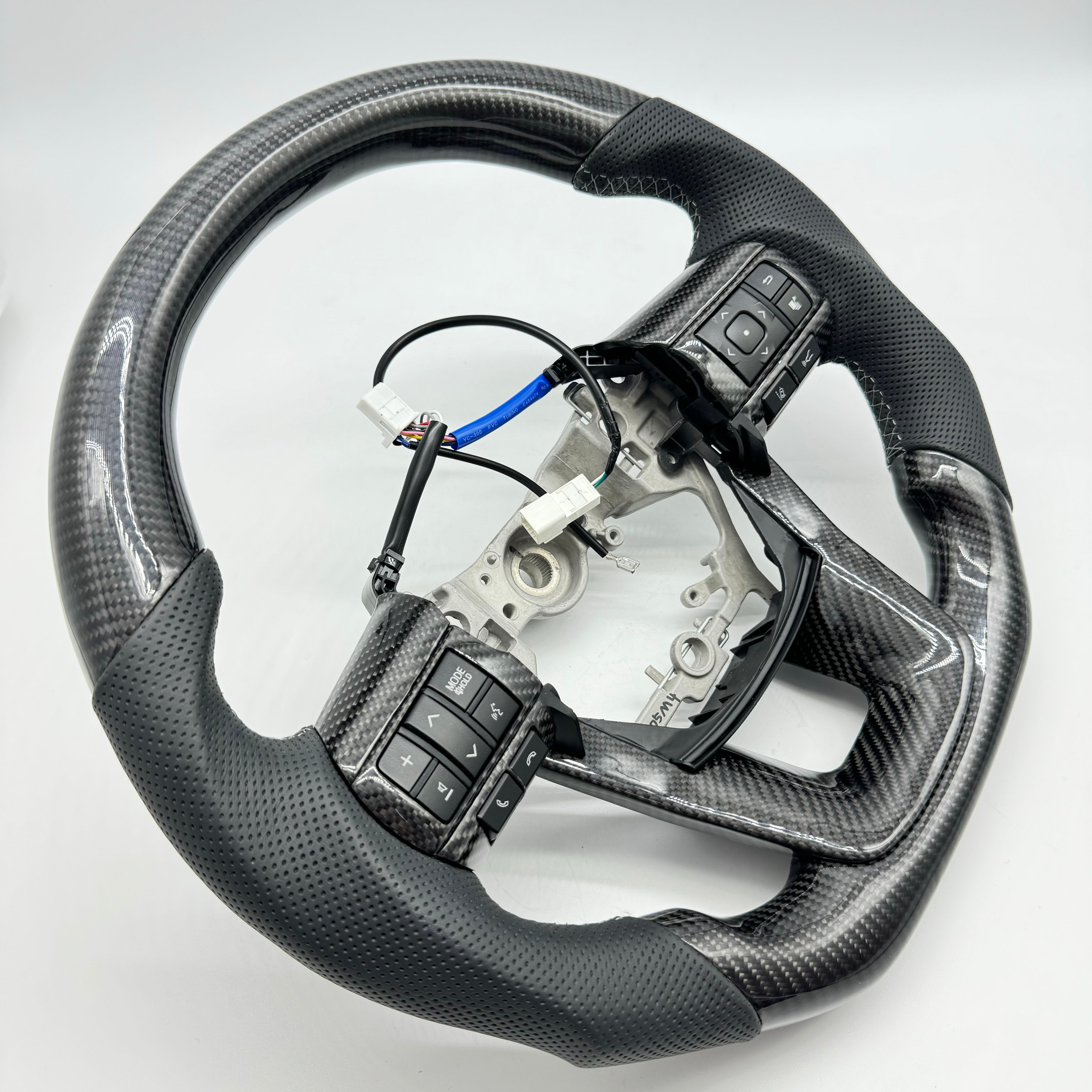 Toyota Hilux N80 (2015–2026) Premium Steering Wheel – Genuine Perforated Leather & Carbon Fibre