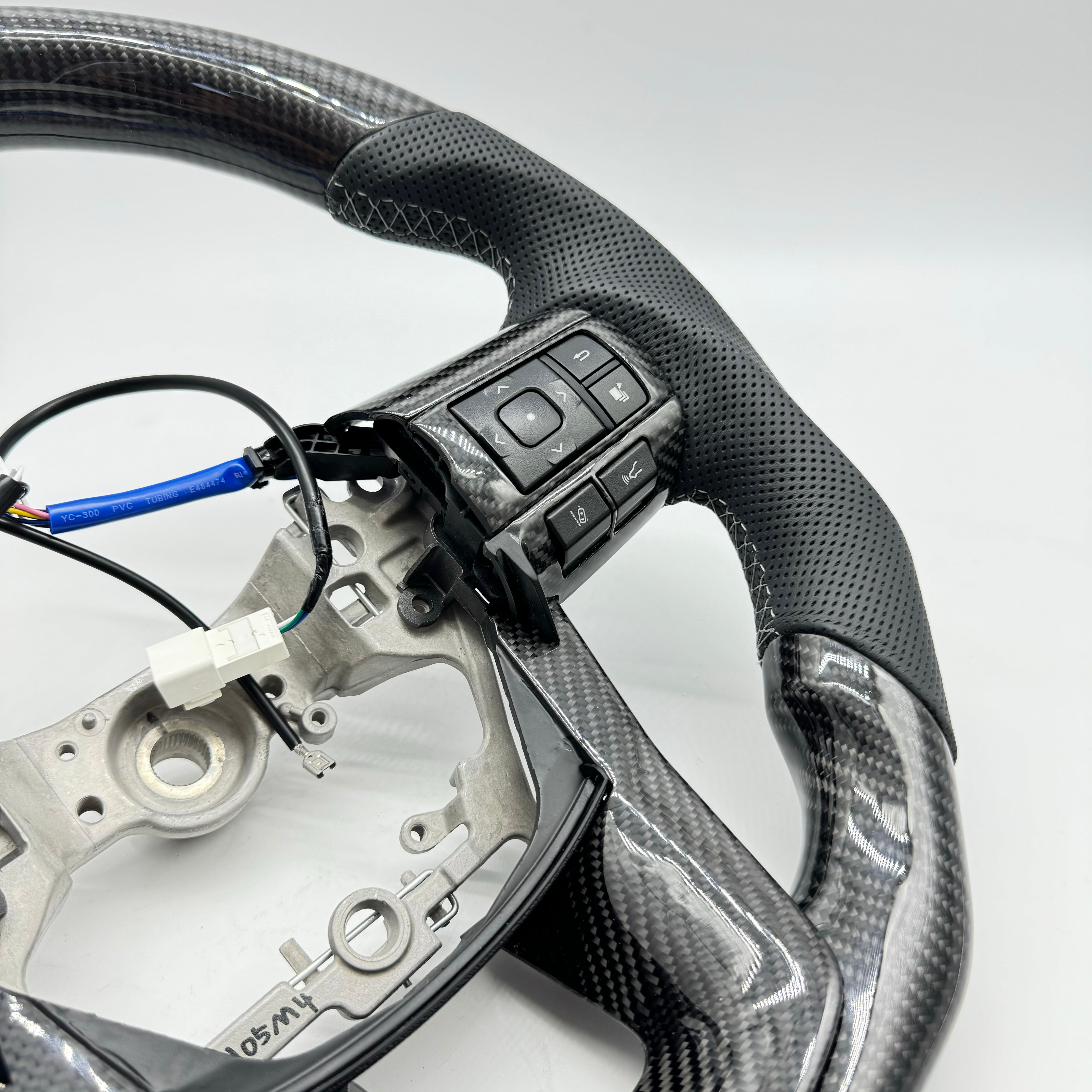 Toyota Hilux N80 (2015–2026) Premium Steering Wheel – Genuine Perforated Leather & Carbon Fibre