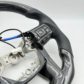 Premium Steering Wheel- Carbon Fiber / Perforated leather suitable for use with Toyota LandCruiser 70 series 2024-On