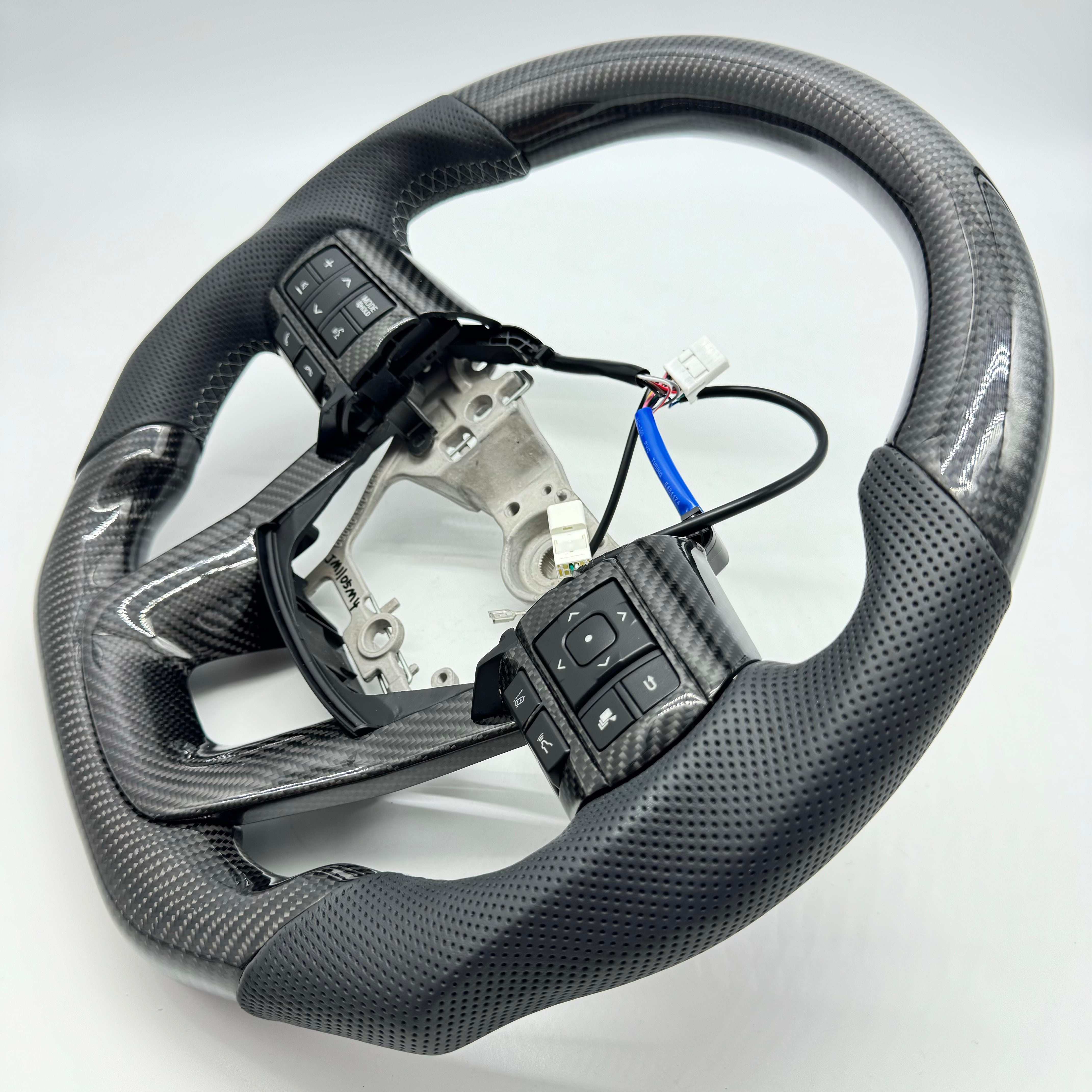 Toyota Hilux N80 (2015–2026) Premium Steering Wheel – Genuine Perforated Leather & Carbon Fibre